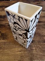 Angled view showing floral pattern and rectangular shape