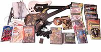 Full lot with consoles, guitars, controller, memory card, games