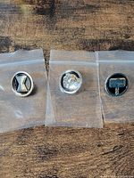 Overview of the three pins in individual bags