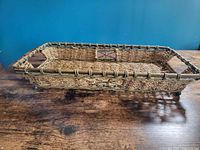 Full side view of rectangular wicker basket tray
