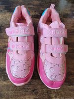 Top view of shoes showing straps, color and pattern