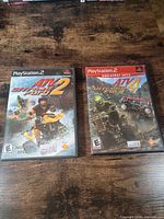 Front view of both game cases showing titles and ESRB ratings