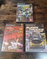 Front covers of all three PS2 game cases