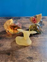 Three Avon perfume bottles grouped on table