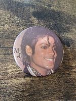 Front view of round Michael Jackson portrait button