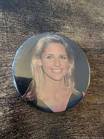 Front view of round pinback button showing Sarah Michelle Gellar portrait