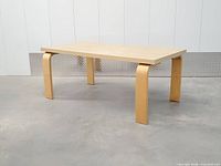 three-quarter view of full table showing top and legs