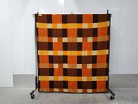 Full view of plaid blanket hanging