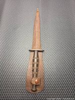 Knife sheathed, full length view