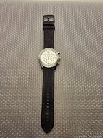 Front view of full wristwatch showing dial, strap, and overall condition