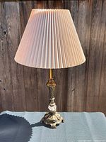 Full view of lamp with shade showing overall design, brass finish and crystal accent