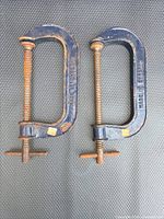 Pair of blue cast iron C-clamps showing Made in England marks
