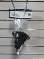 Front view of packaged Attwood motor well boot hanging on display slat wall