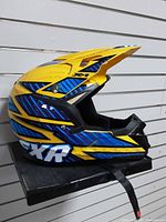 Right side profile showing full shell graphics, peak visor and chin bar