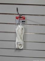 Retail-packaged Kimpex fender loops hanging on display wall