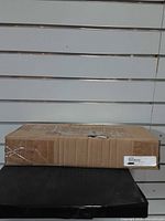 Sealed cardboard box containing Polaris pivot arm