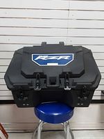 Front view of Polaris RZR cargo box showing overall shape and latches