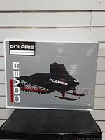 Front of box showing Polaris cover image and branding