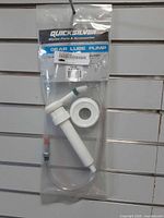 Front view of sealed Quicksilver gear lube pump package showing entire pump, hose and adapter