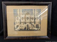 Full front view of framed photograph showing team portrait, mount and frame