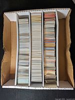 Top view of four-row box filled with trading cards