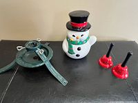 Full lot: metal tree stand, snowman jar, two bells
