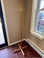 Full view of oak coat stand showing X base and height