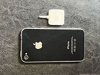 Back view of iPhone with Apple logo and Square reader