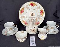 All six porcelain anniversary pieces grouped together