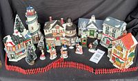 Group shot of entire village set on black cloth