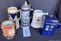 Group shot of five steins and mugs