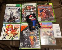 Whole lot showing six game cases and DS carrier