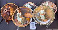Group view of five Rockwell plates