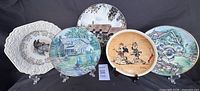 Group shot of five decorative plates front view