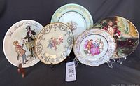 Front view of all five decorative plates