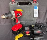 Complete lot showing drill, battery, chargers, stud finder and carrying case