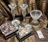 Lot overview showing all glass candle holders and pedestal bowl with boxes