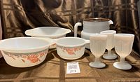 Group shot of all items showing bowls, pitcher, goblets