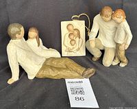 All three figurines displayed, QR tag visible