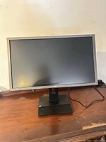 Front view of Acer B246HL monitor on stand with power cord visible