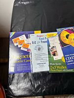 Group shot of six assorted inkjet-printable packs: magnetic business cards, transfer sheets, wallet photo paper, CD/DVD labels, jewel case inserts
