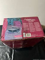 Retail box top showing Contempo Gas Grill graphics and product information