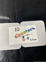 Front view of sealed stack showing label “10 Coasters $5.00”
