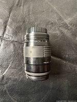 Front angled view of Sigma 35-135mm lens showing barrel and zoom ring
