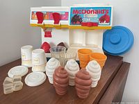 Front view of dispenser with all accessories displayed