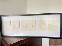 Front view of framed Olunda Picasso animal sketch print