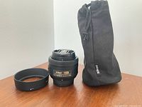 Lens, hood and pouch overview