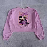 Full view of pink cropped Bratz sweatshirt front