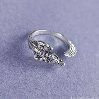Top view of silver gator ring showing head and body detail