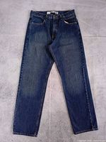 Full front view of jeans laying flat